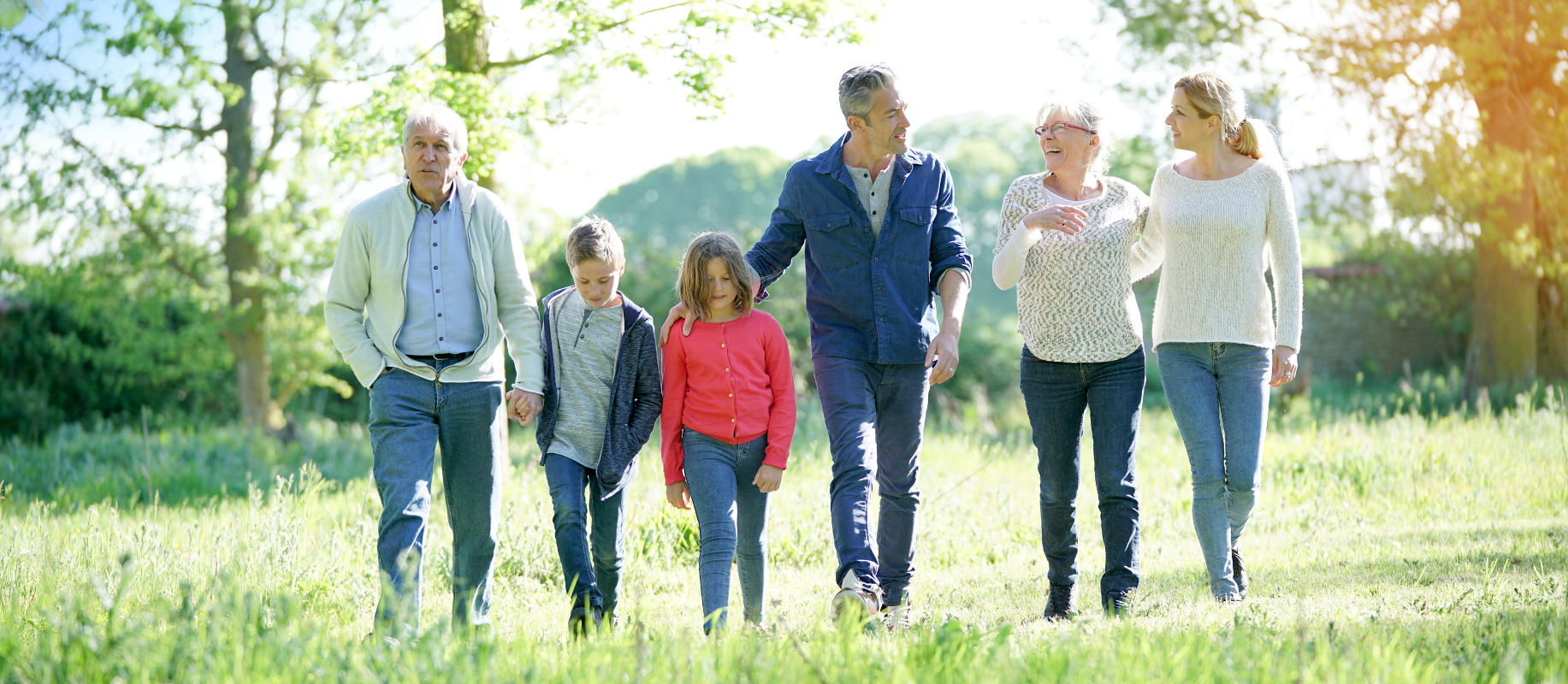 NaturalFit; Dentures & Denture Care: About Us Page: Family Walking in Field